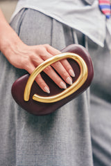 THE CUTEST BURGUNDY CLUTCH