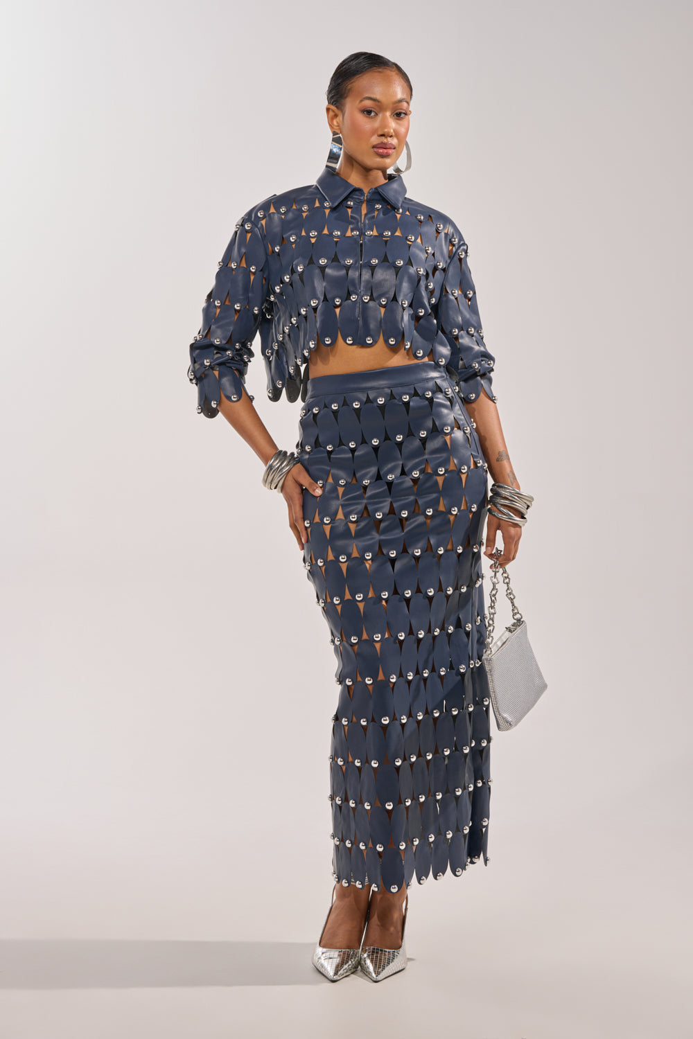 THE SNEAK PEEK STUDDED PU MIDI SKIRT IN NAVY