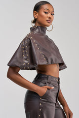 STUDDED FAUX LEATHER CAPE IN DARK CHOCOLATE