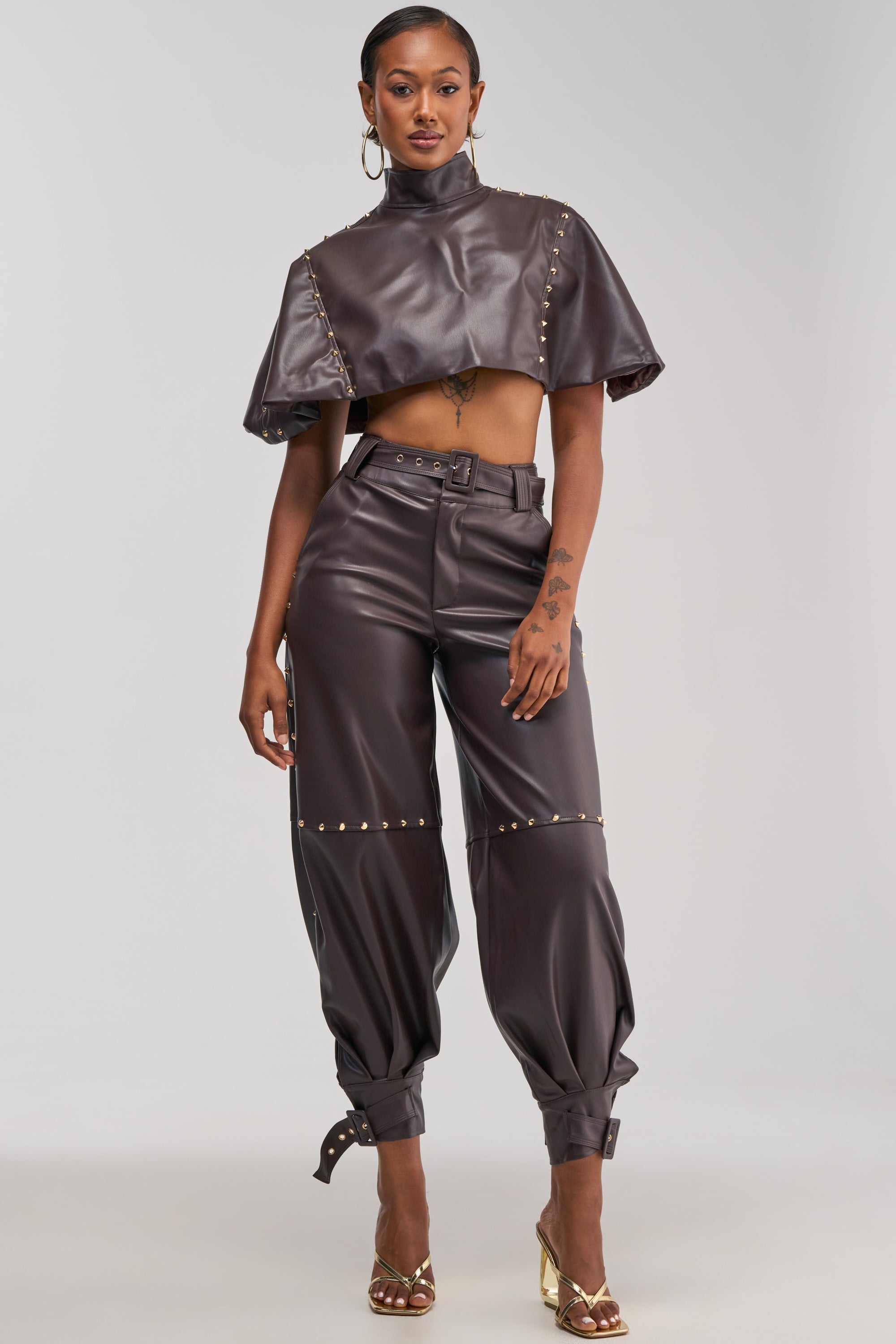 STUDDED FAUX LEATHER CAPE IN DARK CHOCOLATE