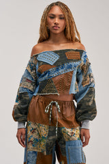 CALL ME CRAZY PATCHWORK OFF THE SHOULDER SWEATSHIRT IN BROWN MULTI