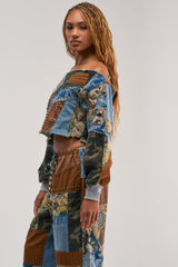 CALL ME CRAZY PATCHWORK OFF THE SHOULDER SWEATSHIRT IN BROWN MULTI
